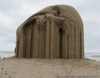 Illustration for article titled This remarkable sand sculpture will make your face melt